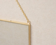 Load image into Gallery viewer, 8x10" Brass &amp; Glass Horizontal Hanging Photo Frame in Gold
